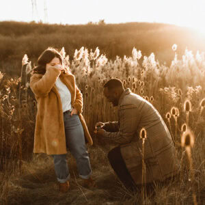 niagara engagement man down on one knee proposing in golden light