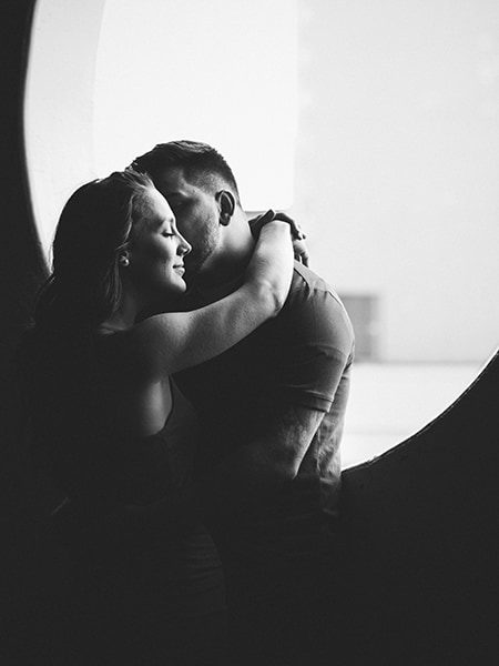 couple intimate embrace in parking garage Niagara, black and white