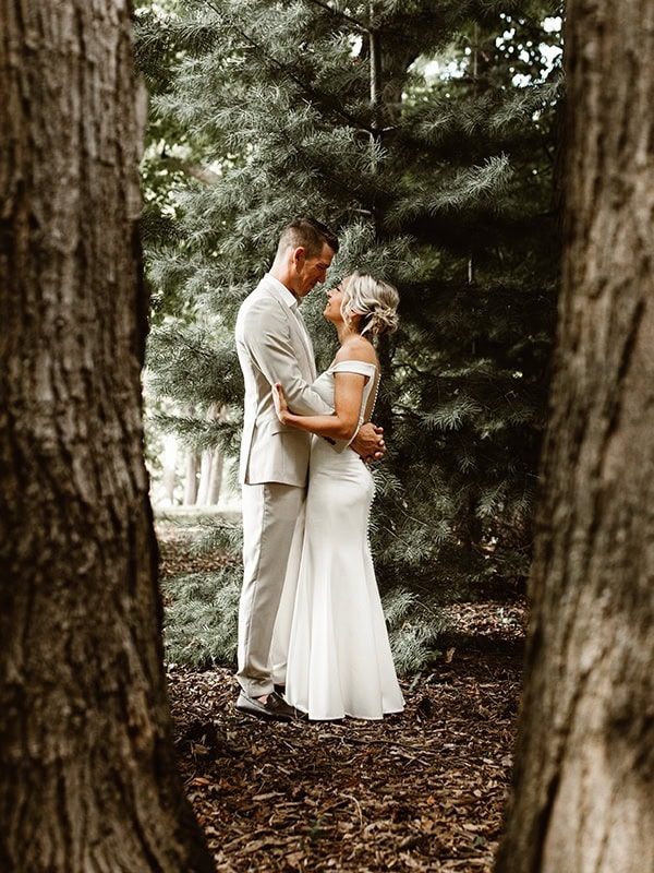 niagara couple gazing into each others eyes in the forest