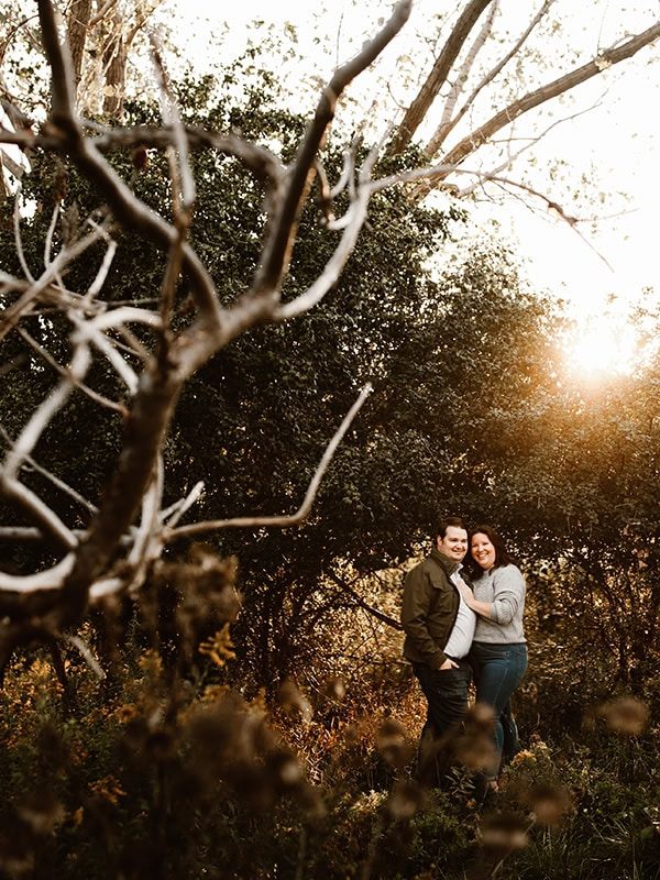 newly engaged couple embracing at rotary park in st catharines