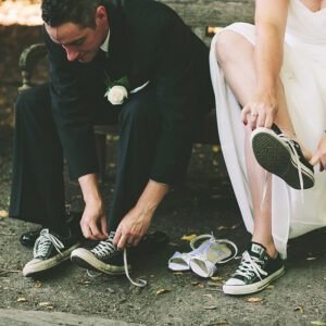 newlyweds tying their chucks shoes in niagara on the lake 